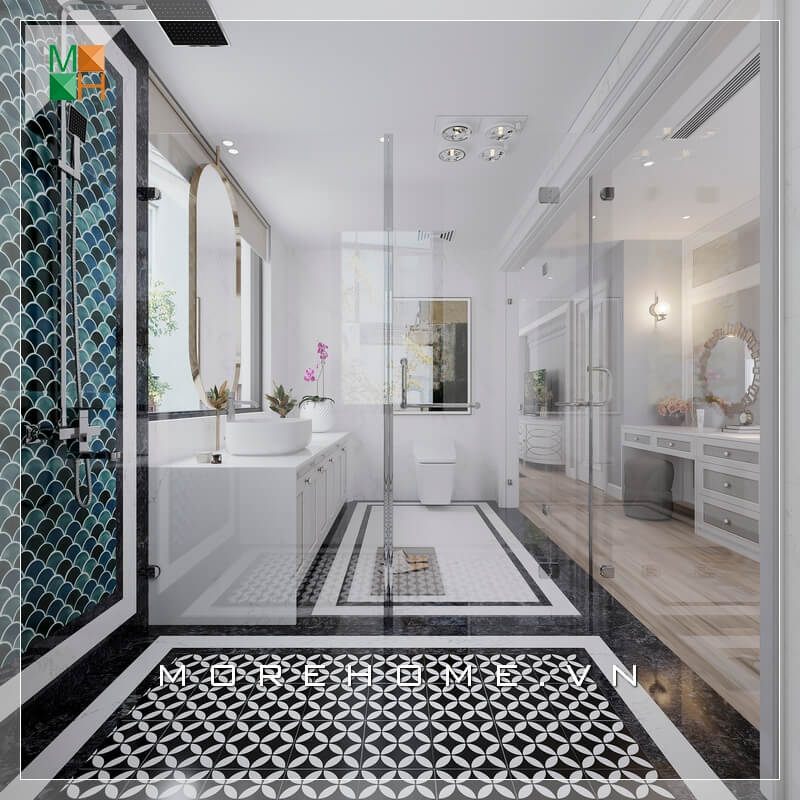 Để tránh sự nhàm chán khi sử dụng tông trắng làm chủ đạo, KTS Morehome đã khéo léo kết hợp gạch ốp tường và gạch lát sàn phòng tắm màu tối để tạo điểm nhấn, kết hợp vách kính tắm cường lực 2 bên giúp tạo sự liên kết trong không gian ngôi nhà
